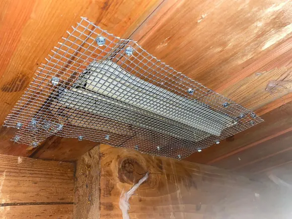 Rodent exclusion screen on ceiling vent opening